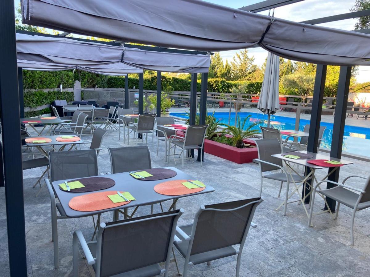 Logis Hotel Restaurant Les Aubuns Caissargues Buitenkant foto