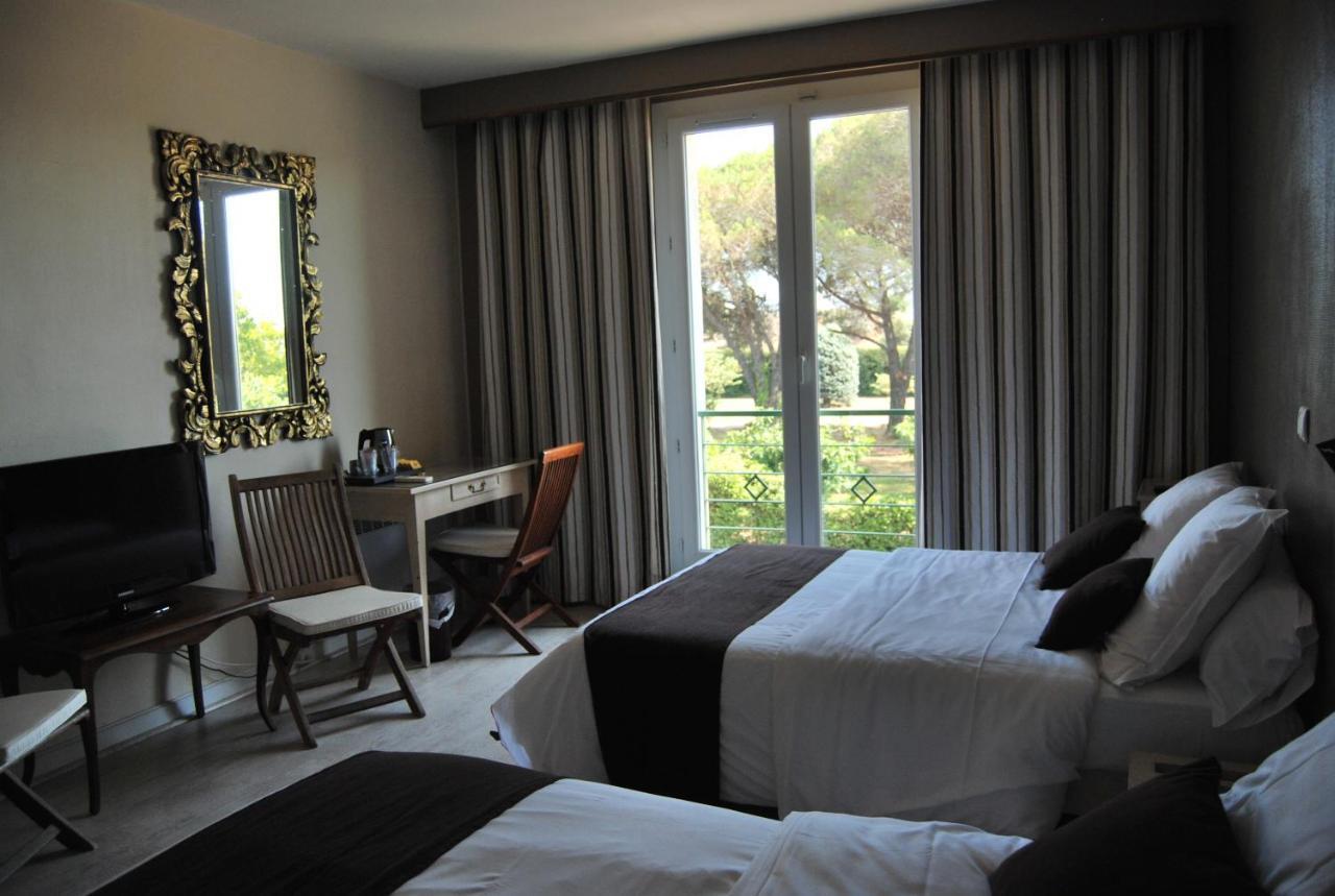 Logis Hotel Restaurant Les Aubuns Caissargues Kamer foto